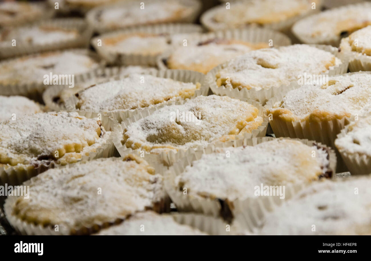 Homemade mince pies on a cooling rack. Stock Photo