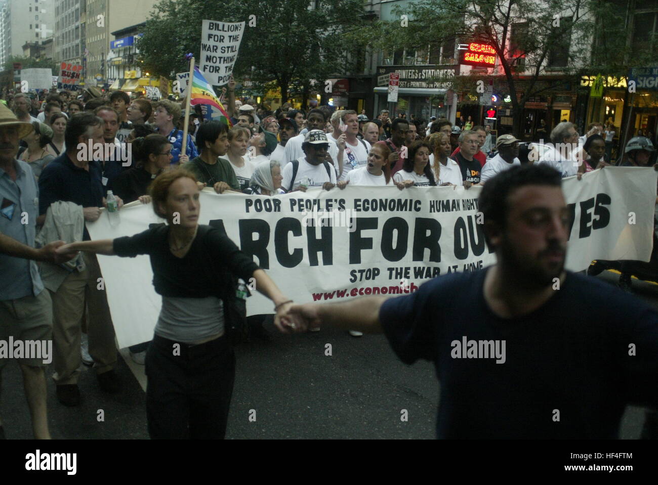 Protesters march against George W. Bush, the Republican administration, the war in Iraq and for other causes, during the Poor People's March. Protests continued through the week of the 2004 Republican National Convention in New York City. Stock Photo