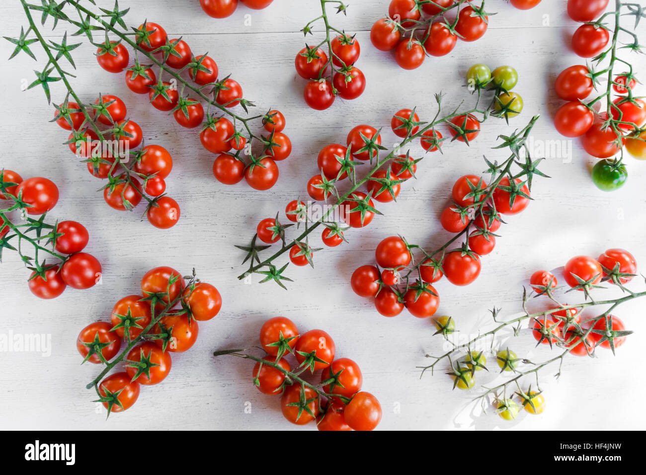 Ripe cherry tomatoes on a white background Stock Photo - Alamy