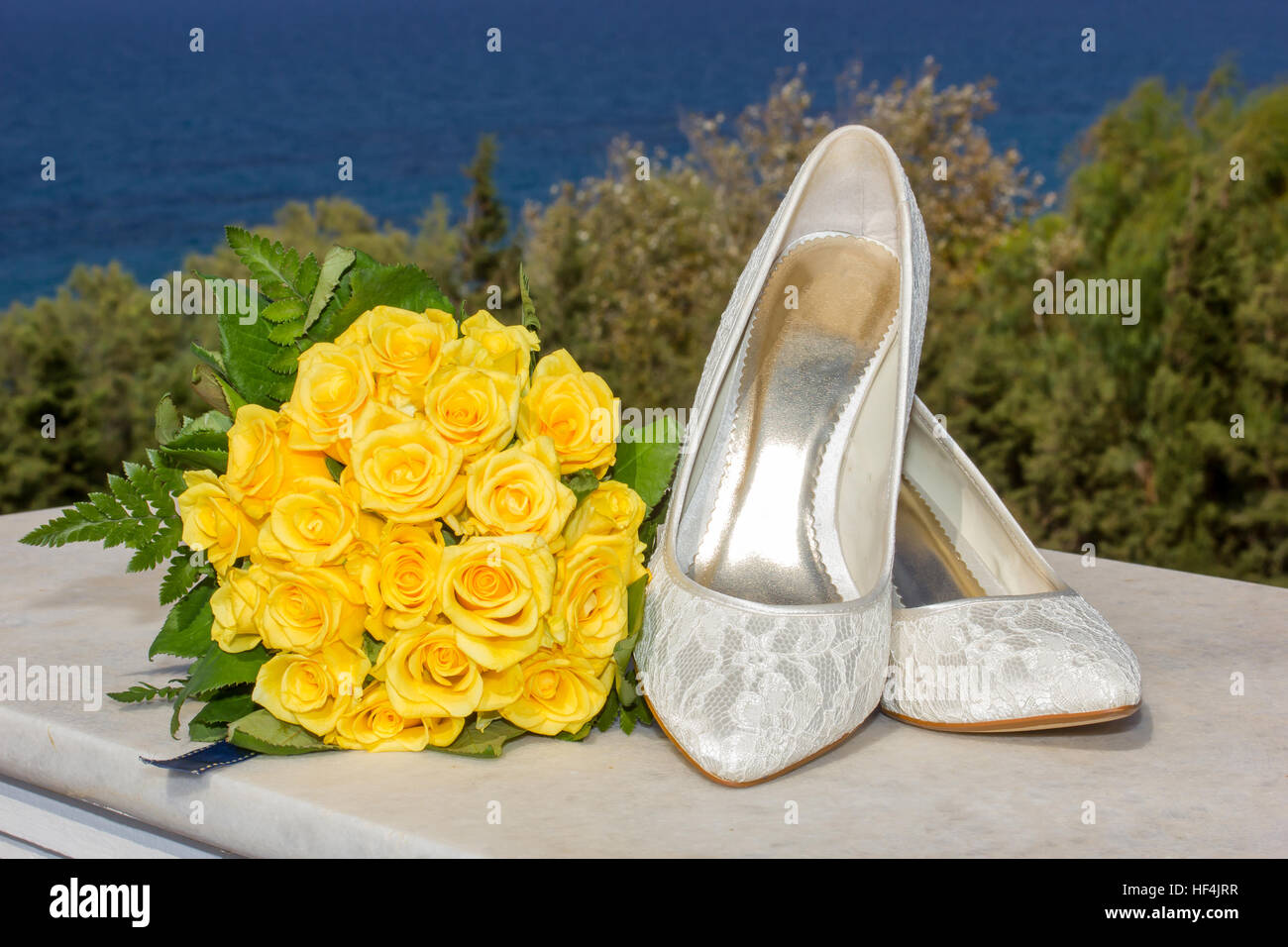 bridal shoes and wedding flower bouquet Stock Photo - Alamy