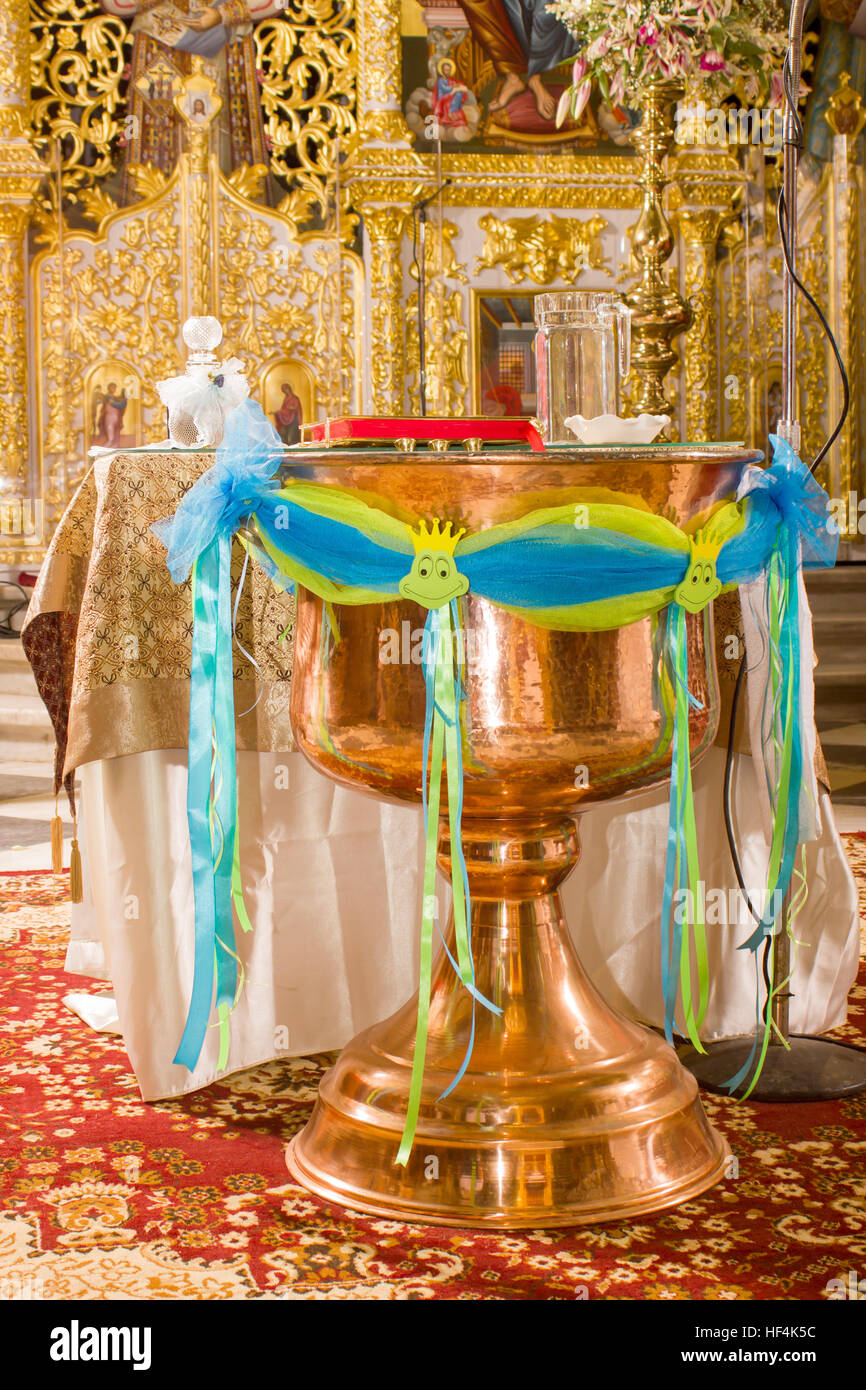 christening bowl in a church decorated with colorful veil Stock Photo Alamy