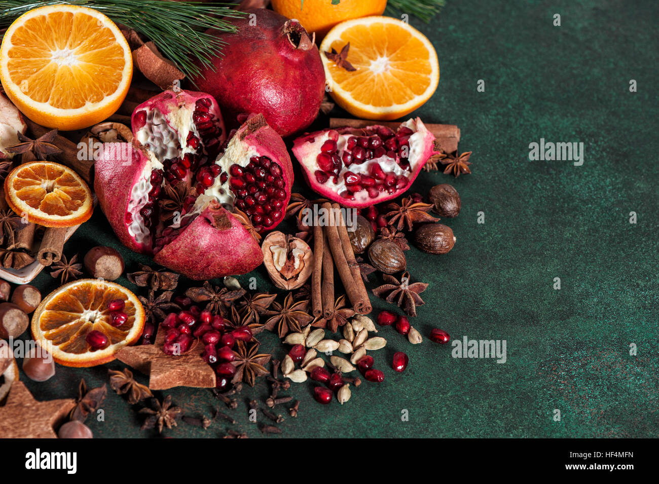 https://c8.alamy.com/comp/HF4MFN/fruits-pomegranate-and-orange-with-spices-and-ingredients-for-mulled-HF4MFN.jpg