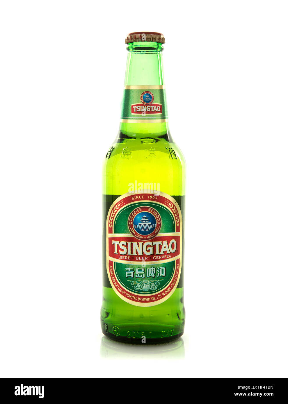 330ml Bottle of Tsingtao Beer on white background, Tsingtao Beer comes from China Stock Photo