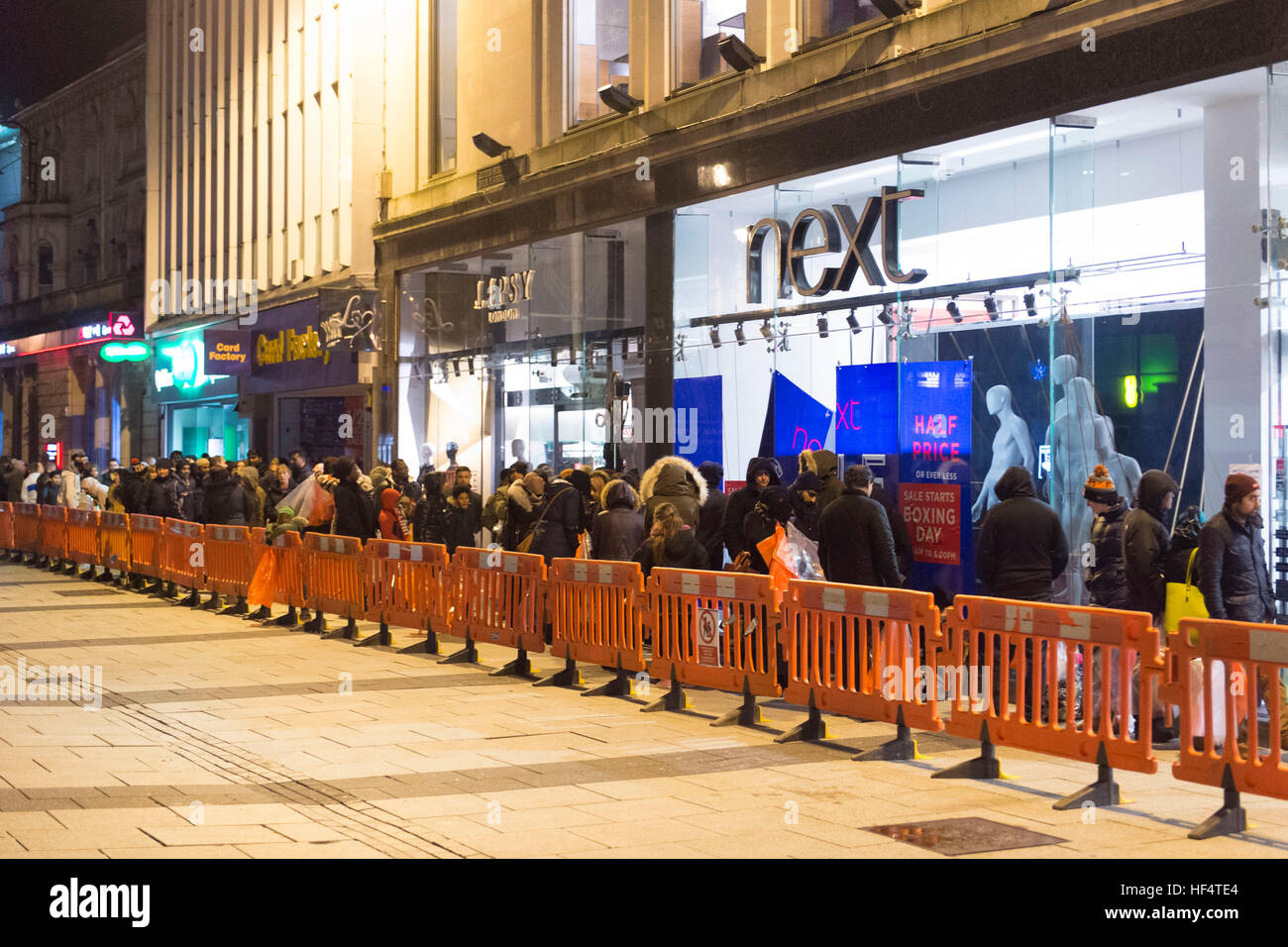 Shoppers queue outside the Next store on Queen Street, Cardiff, from 1am for the Next boxing day sale. Stock Photo
