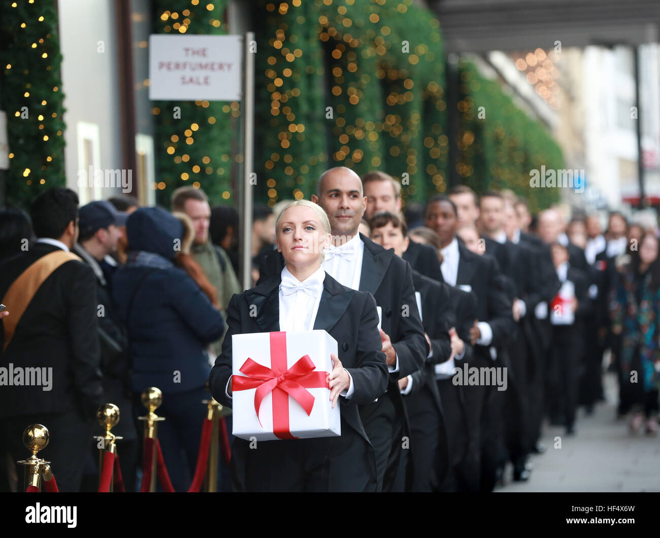 EDITORIAL USE ONLY Harrods butlers serve up a surprise at the opening