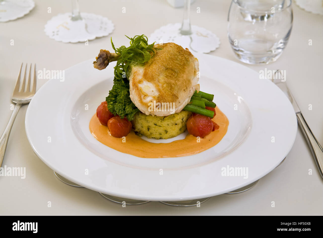 Nouvelle cuisine served in restaurant place setting Stock Photo