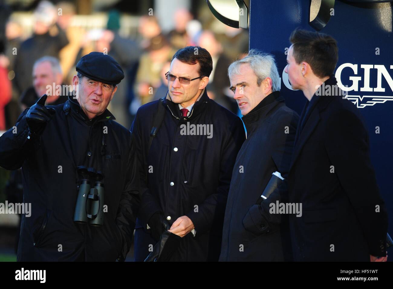 Owner JP McManus watches Thistlecrack win the King George Chase VI at Kempton on the big TV screen with trainer Aidan O'Brien (second left), jockey Ruby Walsh (second right) and trainer Joseph O'Brien during day one of the Christmas Festival at Leopardstown Racecourse. Stock Photo