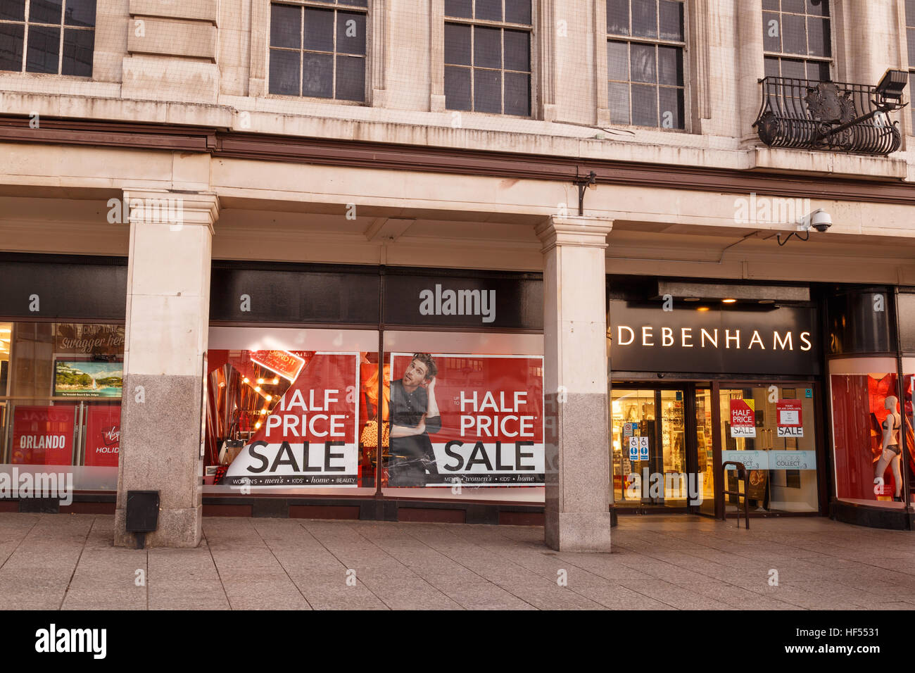 Half price sale posters in Debenhams window on Boxing Day in Nottingham. In Nottingham, England. On 26th December 2016 Stock Photo