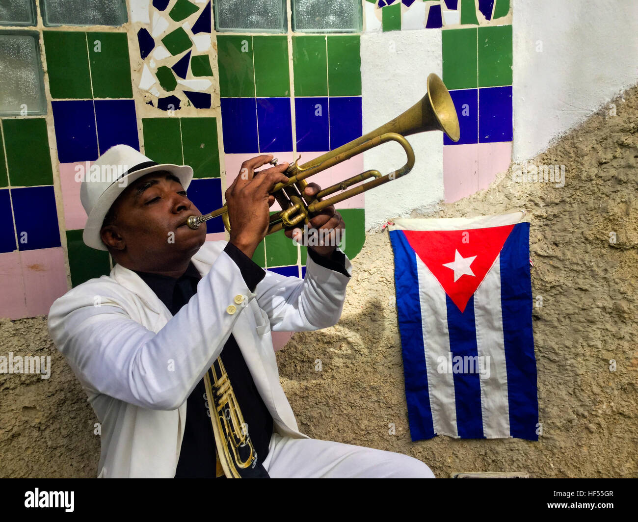 Street musician with Cuban flag in Old Town, Havana, Cuba Stock Photo