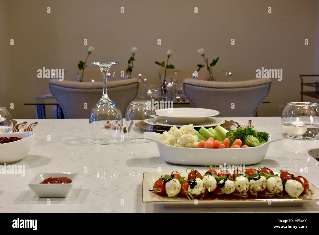 Prepared holiday food displayed on a white carrera marble island Stock Photo