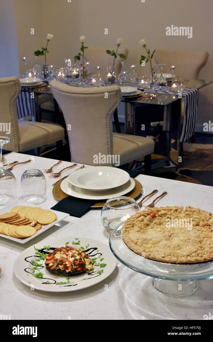 Prepared holiday food displayed on a white carrera marble island Stock Photo