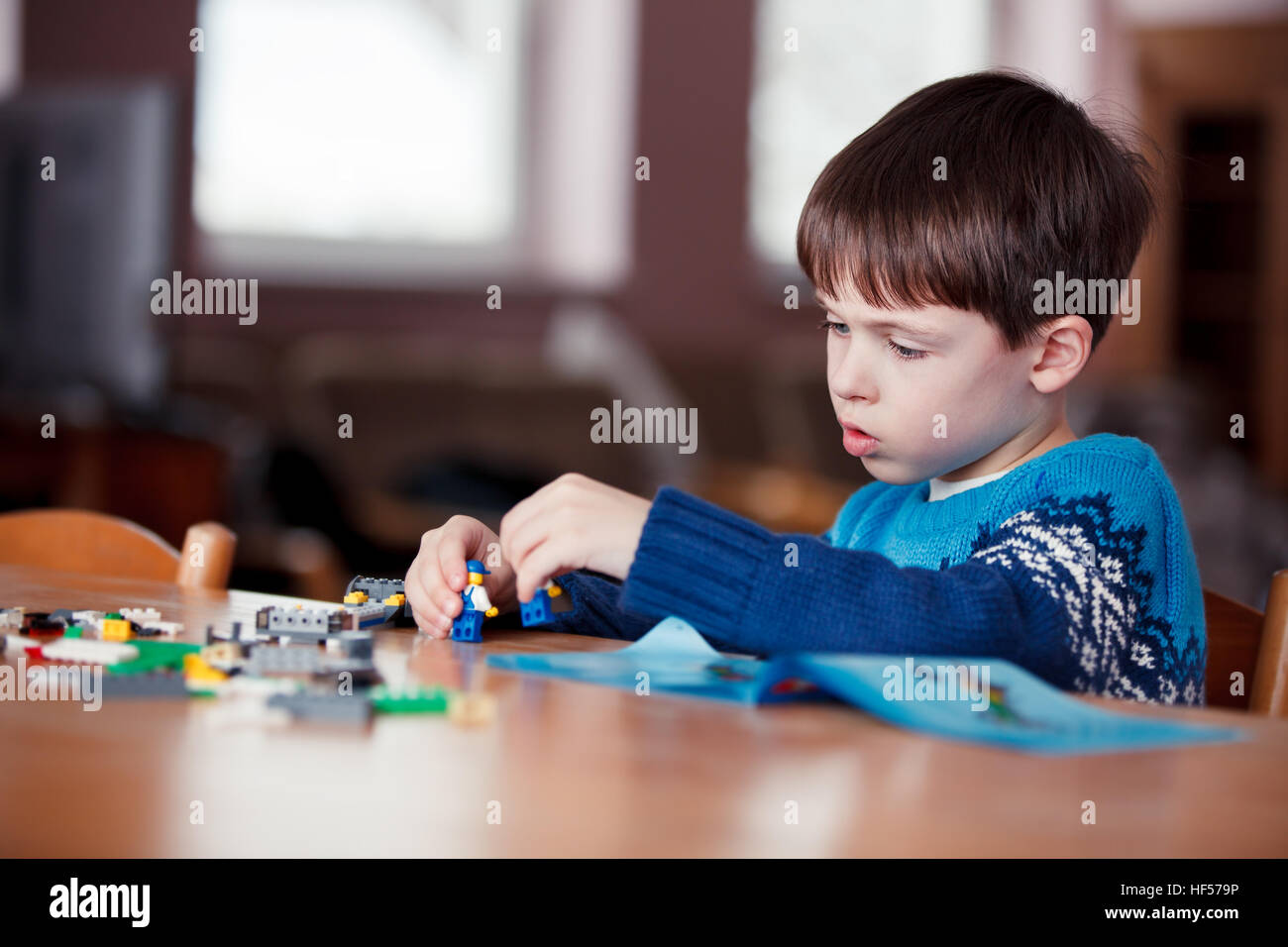 Five years old boy playing with building blocks Stock Photo Alamy