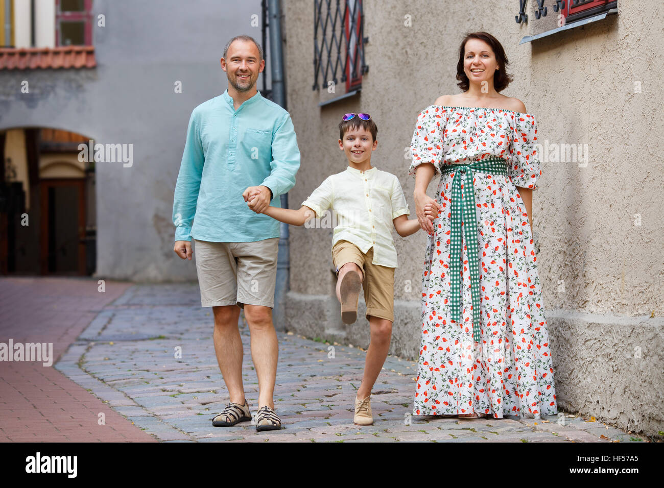 Happy young family in city street Stock Photo