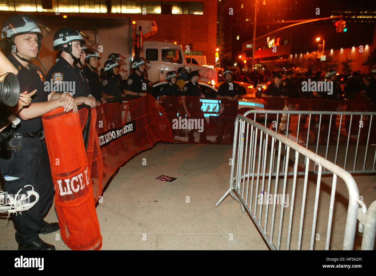 Members of the NYPD, New York Police Department, make barriers to ...