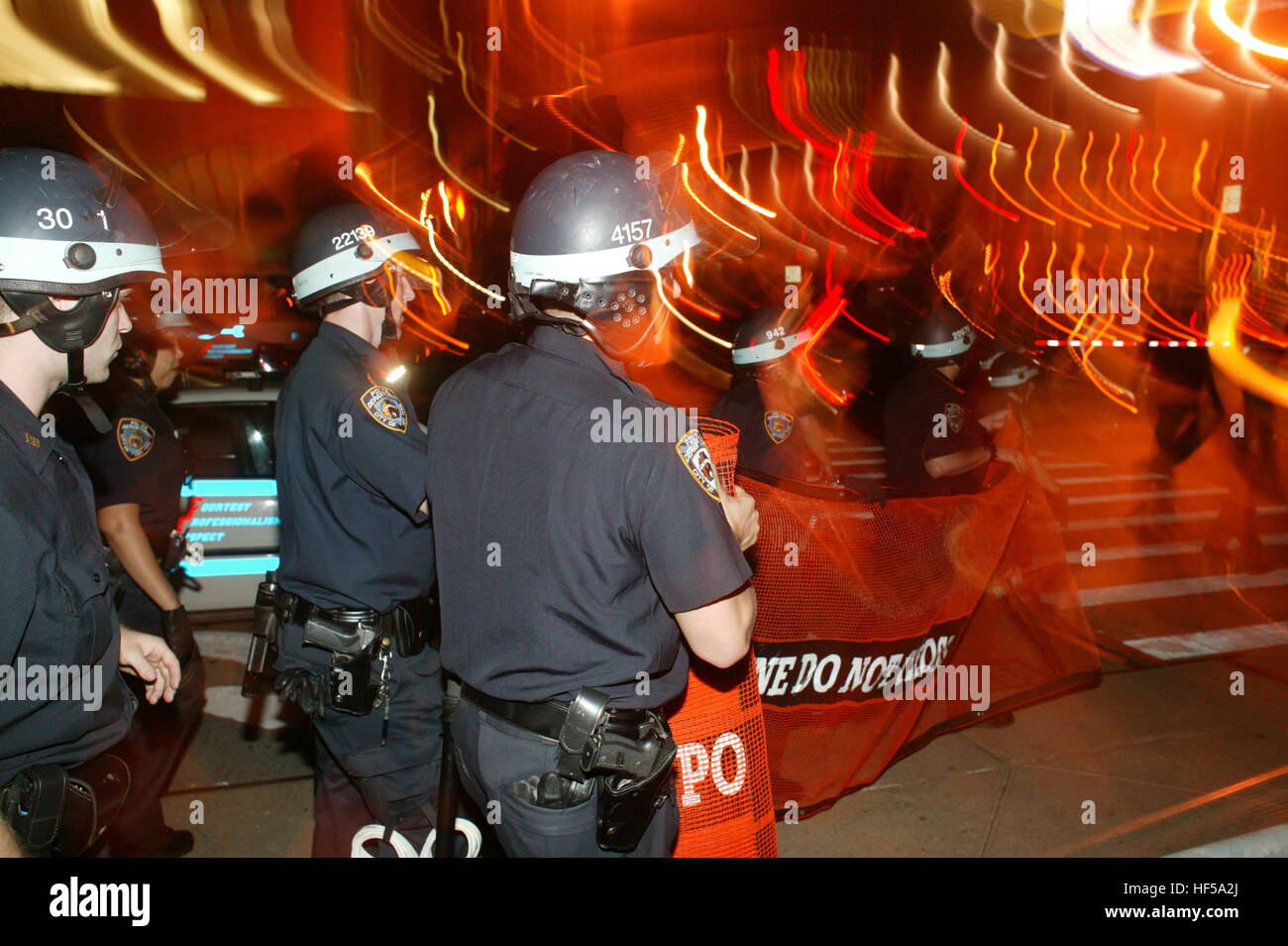 Members of the NYPD, New York Police Department, make barriers to
