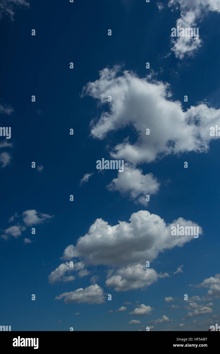 Puffy White Clouds in a Blue Sky Stock Photo - Alamy