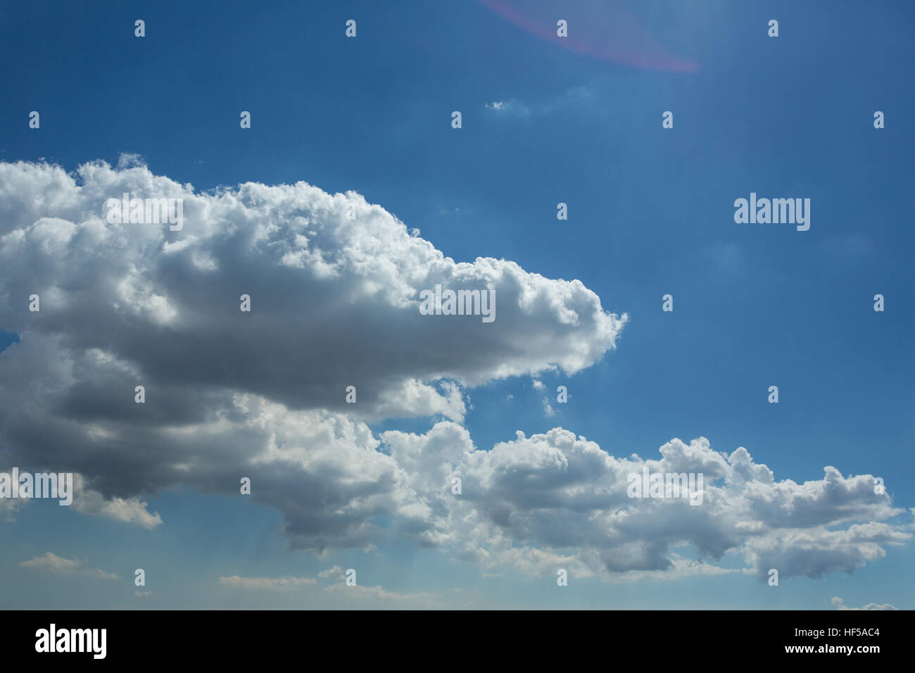 Puffy White Clouds in a Blue Sky Stock Photo - Alamy