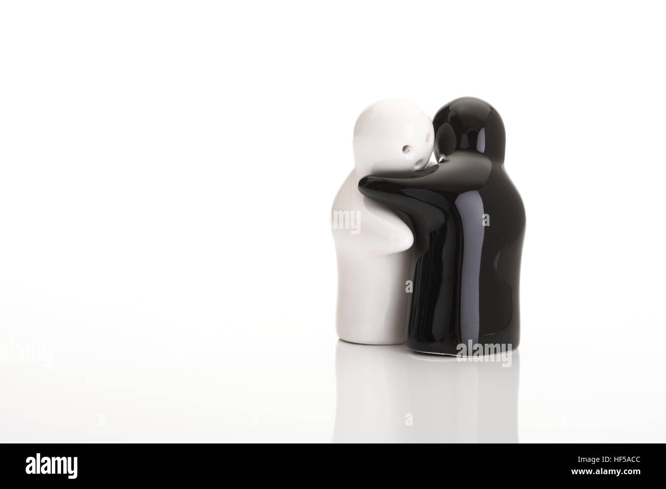 The hug - symbolic picture - ghost salt and pepper shakers Stock Photo