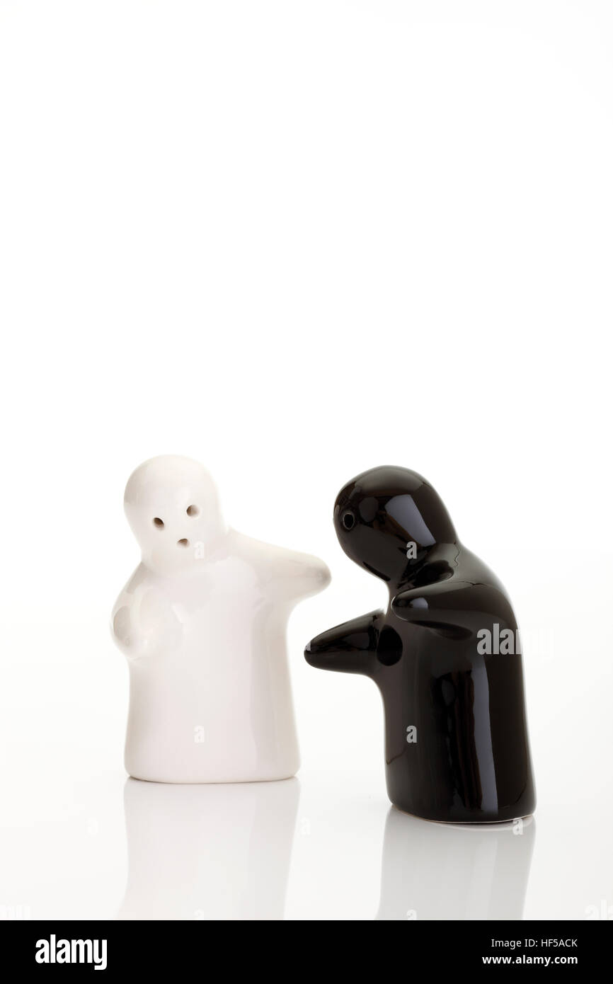 The encounter - symbolic picture - ghost salt and pepper shakers Stock Photo