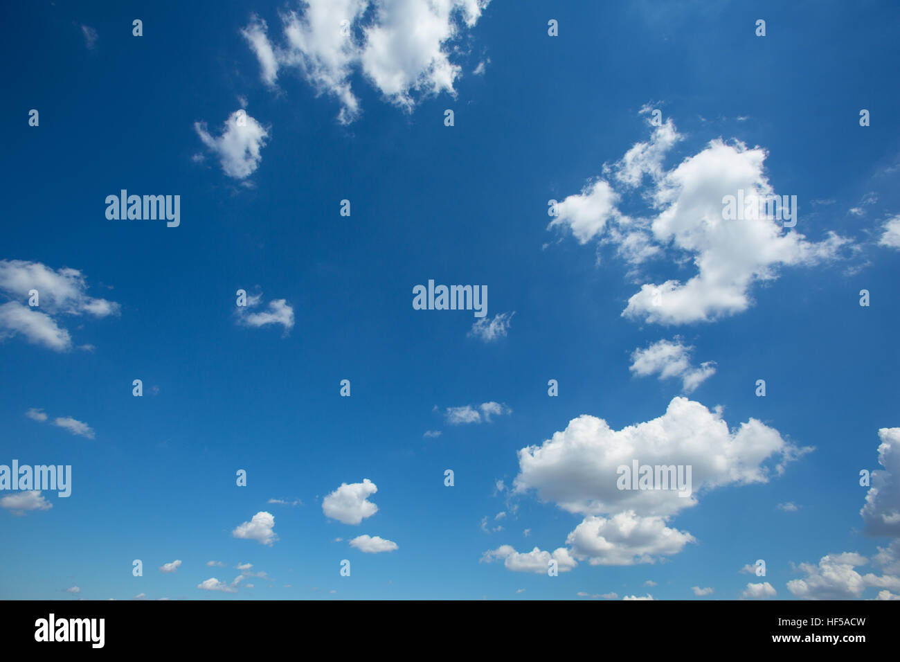 Puffy White Clouds in a Blue Sky Stock Photo - Alamy