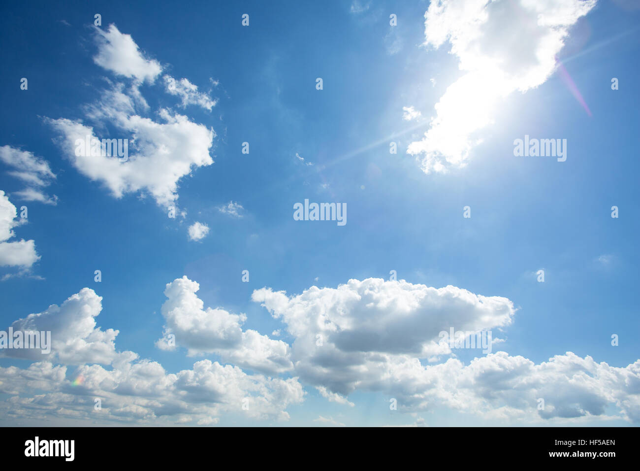 Puffy White Clouds in a Blue Sky Stock Photo - Alamy