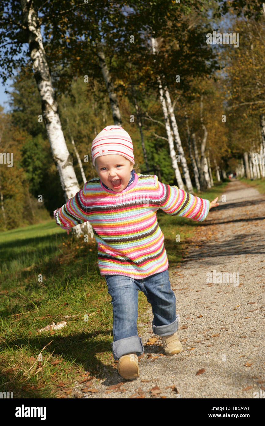 Threeyearold girl running Stock Photo Alamy