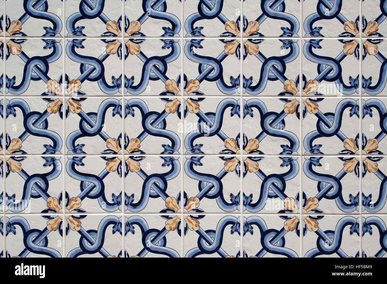 Traditional blue, white and gold portuguese tiles Stock Photo