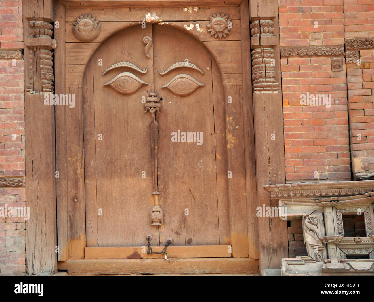 Wooden Carving on Door of the Buddha's all Seeing Eyes in the Hanuman Dhoka Durbar Square Museum in Kathmandu, Nepal.Asia. Stock Photo