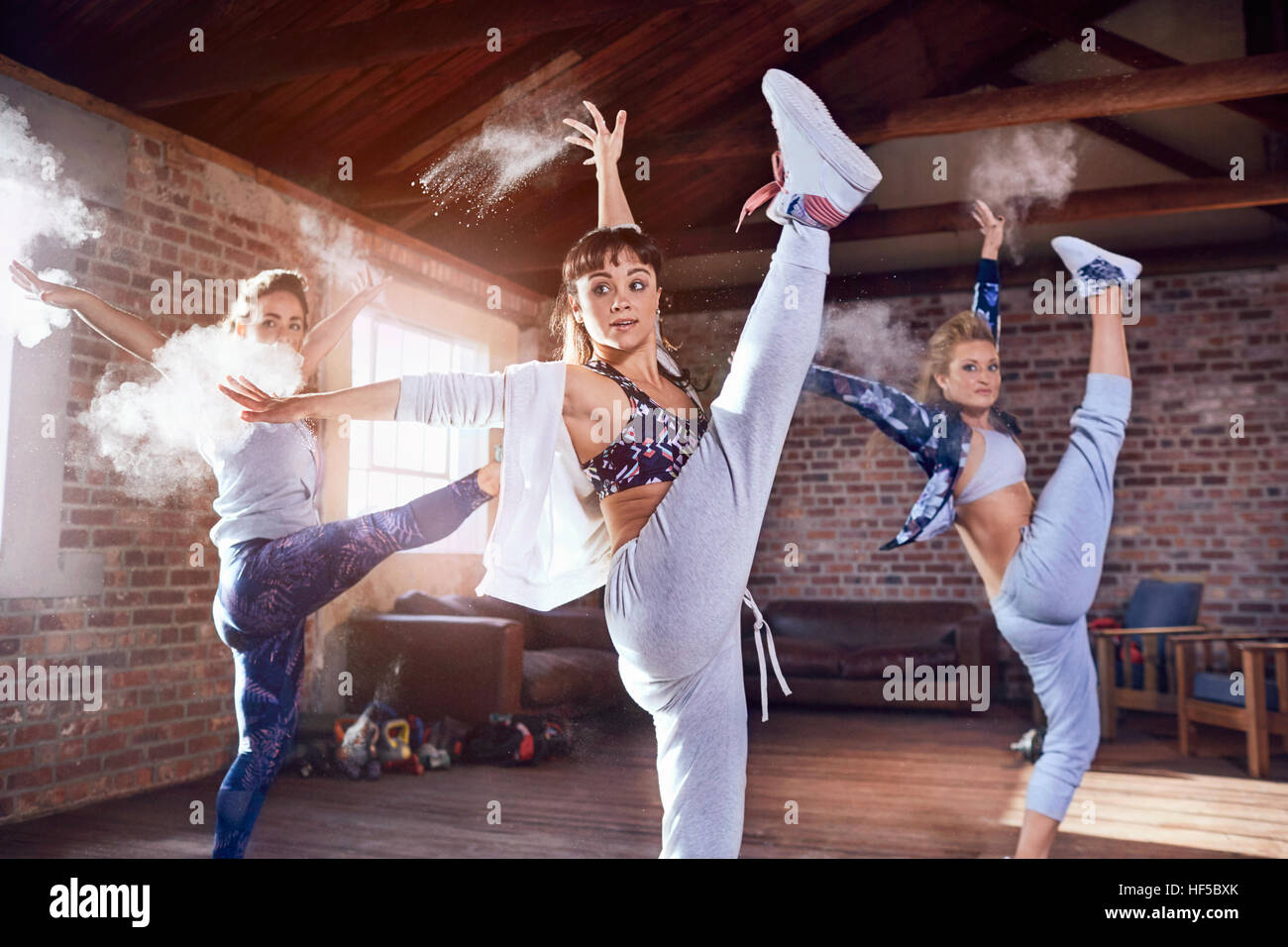 Hip hop dancers dancing with powder in studio Stock Photo