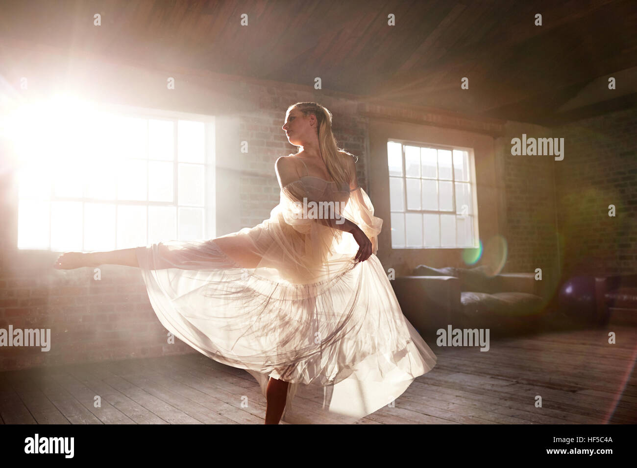 Blonde woman dancing back view hi-res stock photography and images - Alamy