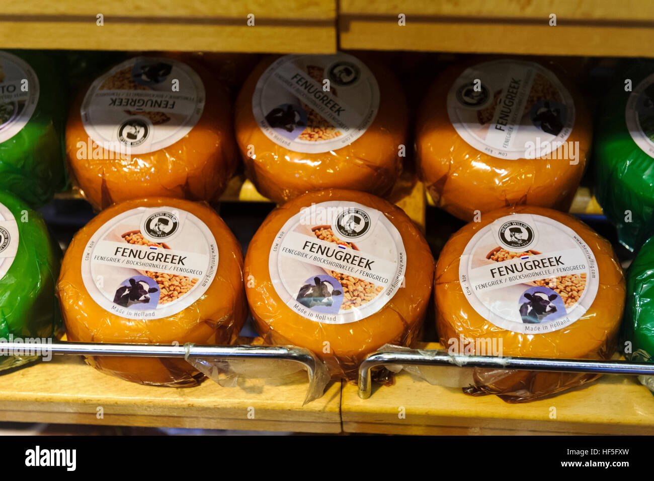 A large selection of Dutch cheeses on sale in a cheese factory in