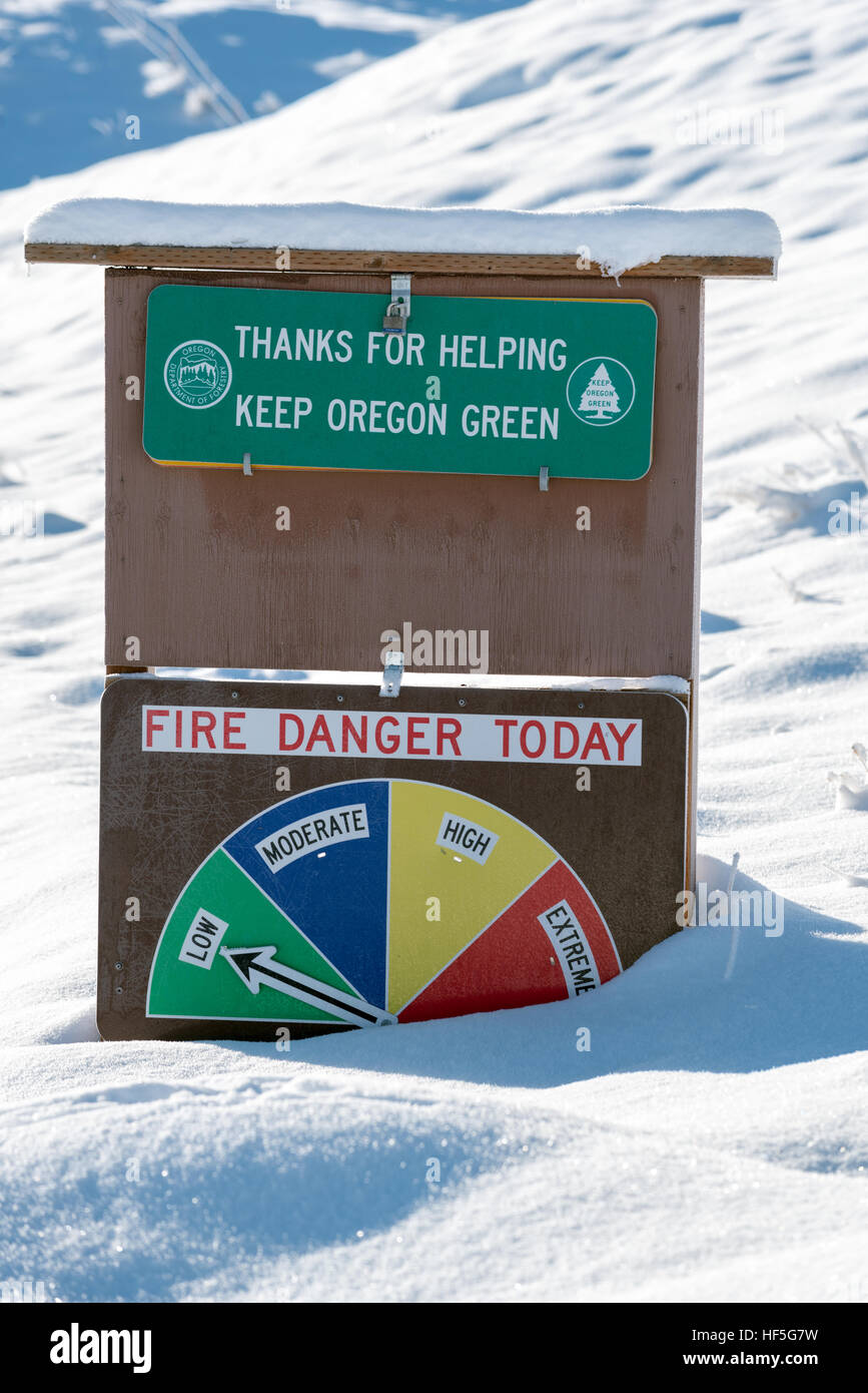 Fire danger sign in winter, Wallowa County, Oregon. Stock Photo