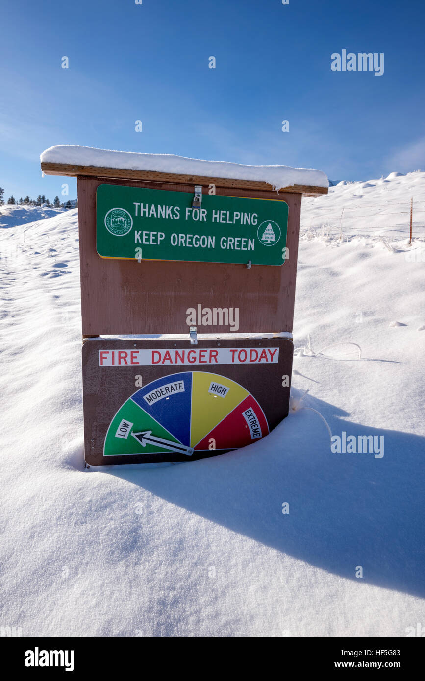 Fire danger sign in winter, Wallowa County, Oregon. Stock Photo