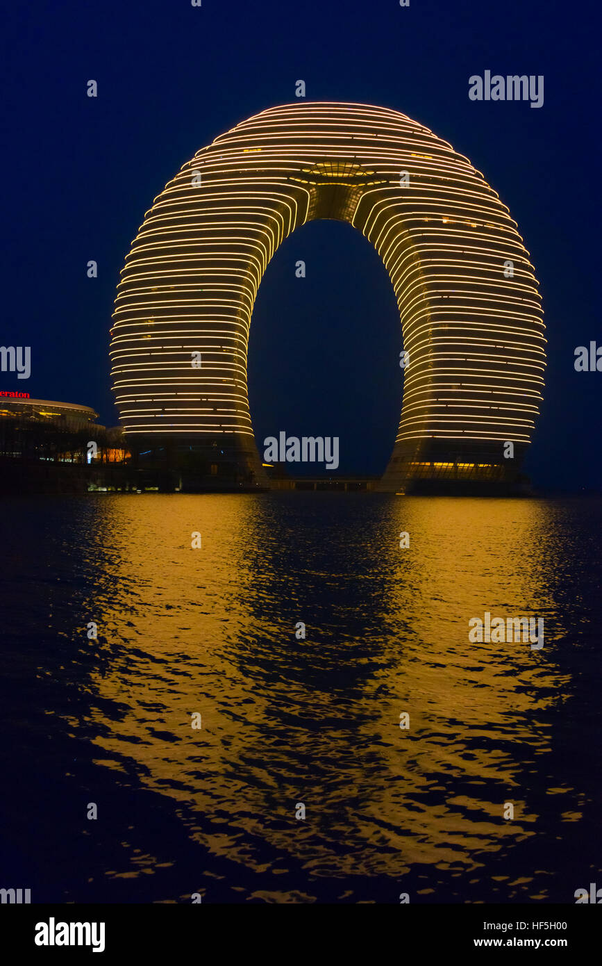 Night view of horseshoe shaped Sheraton Huzhou Hot Spring Resort on
