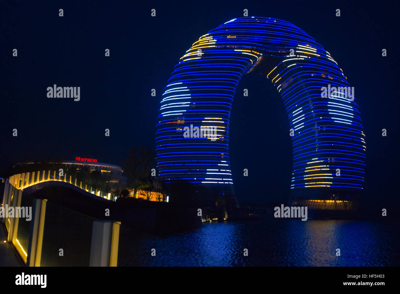 Night view of horseshoe shaped Sheraton Huzhou Hot Spring Resort on Lake Taihu, Huzhou, Jiangsu Province, China Stock Photo