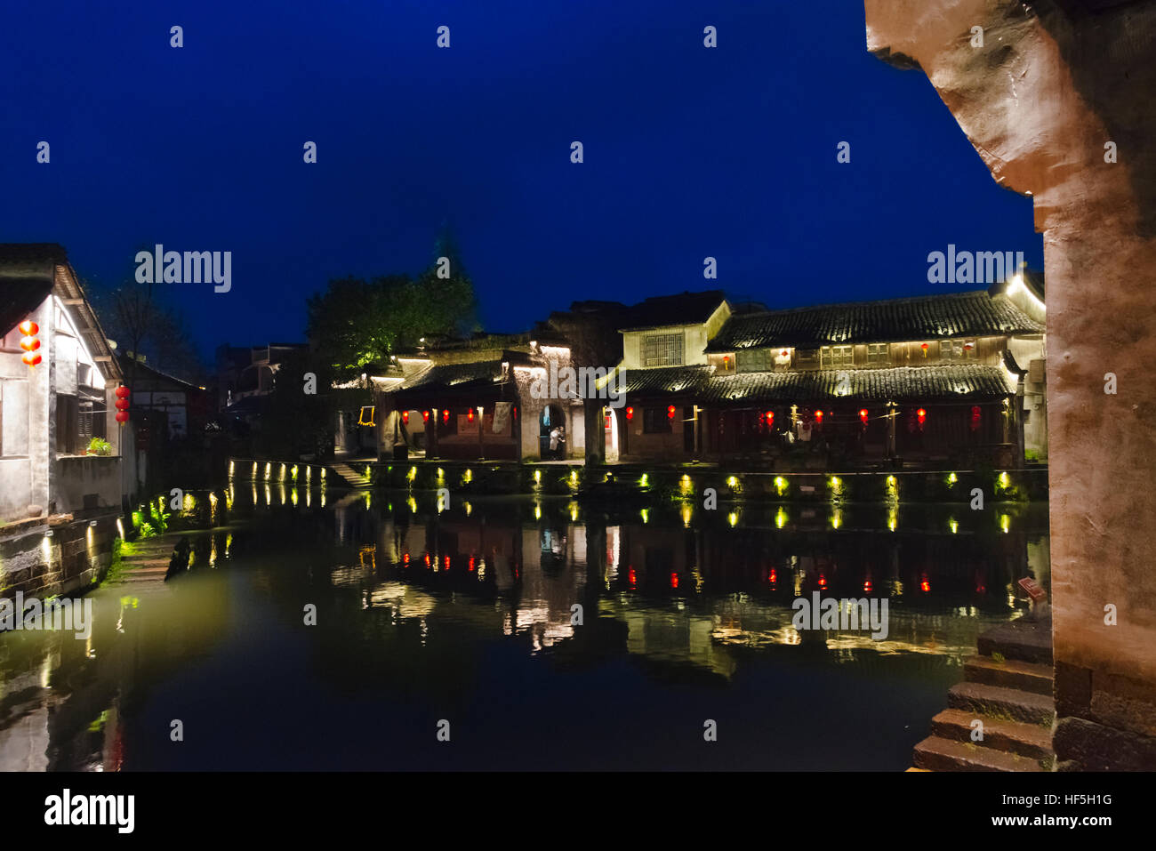 Night view of traditional houses along the Grand Canal, Xinshi Ancient Town, Zhejiang Province, China Stock Photo