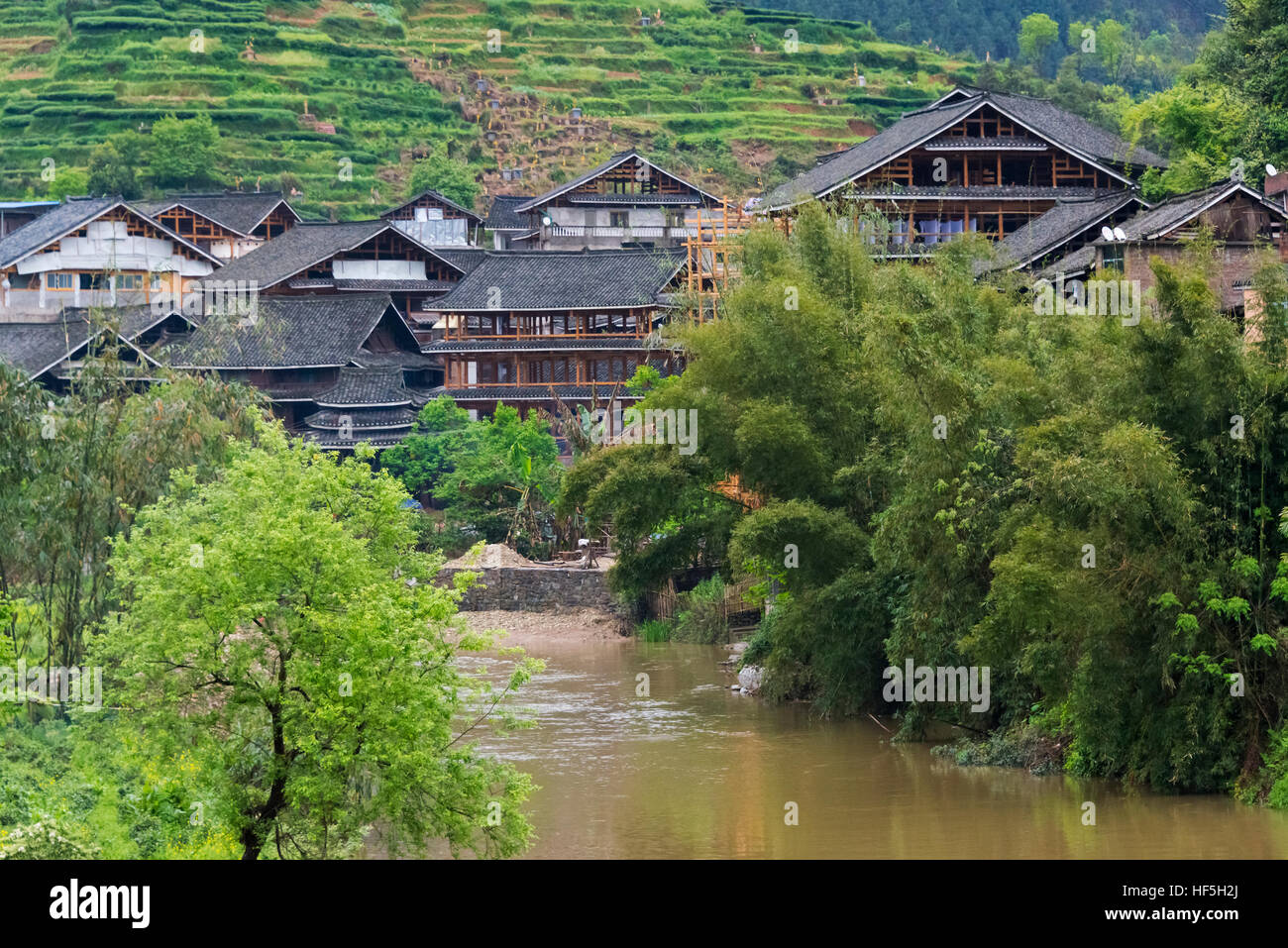 Village with river, Chengyang, Sanjiang, Guangxi Province, China Stock Photo