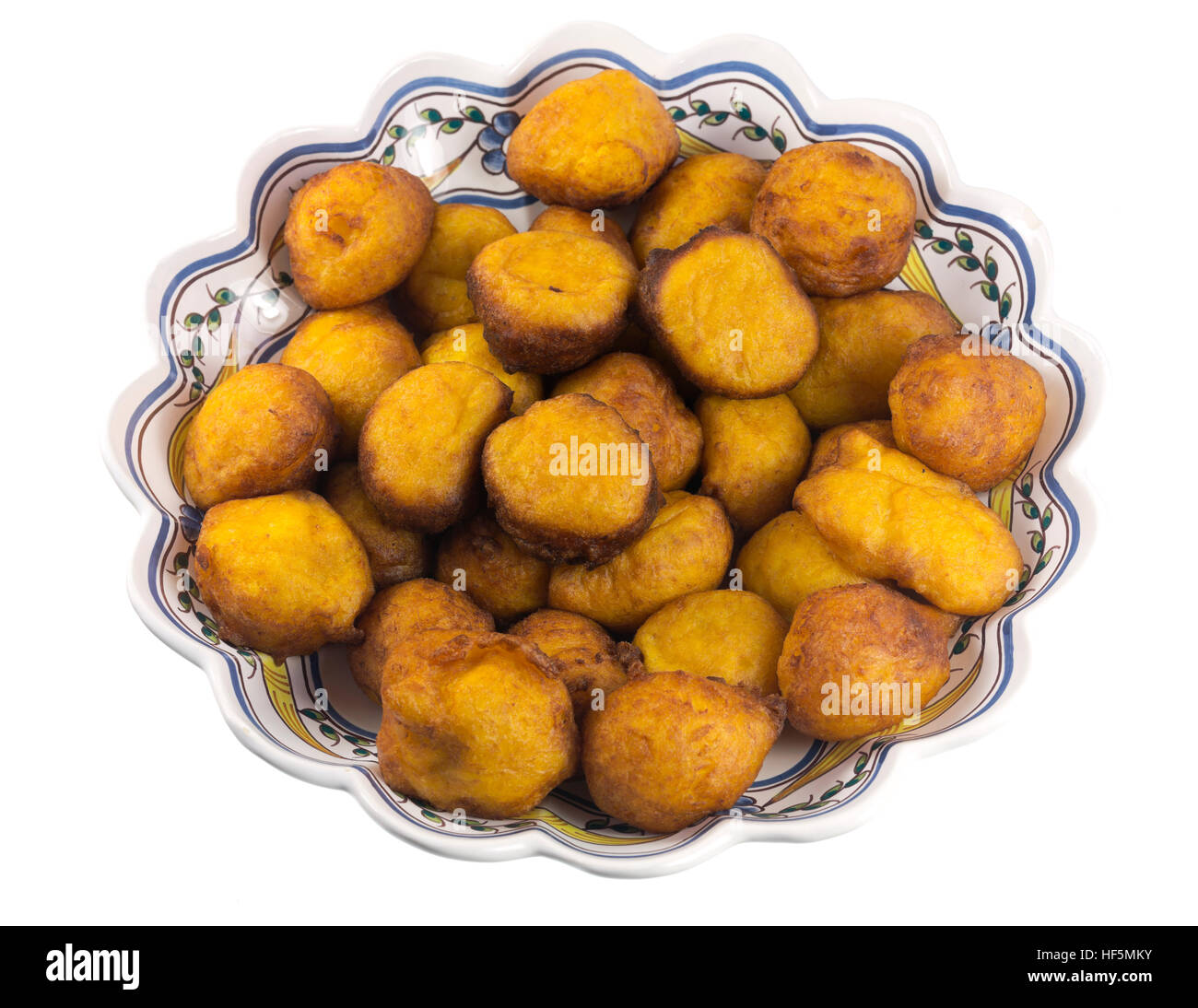 Filhoses de Abobora, or pumpkin fritters, are small yellow pumpkin fried cakes tradionally made during the Christmas season in Portugal Stock Photo