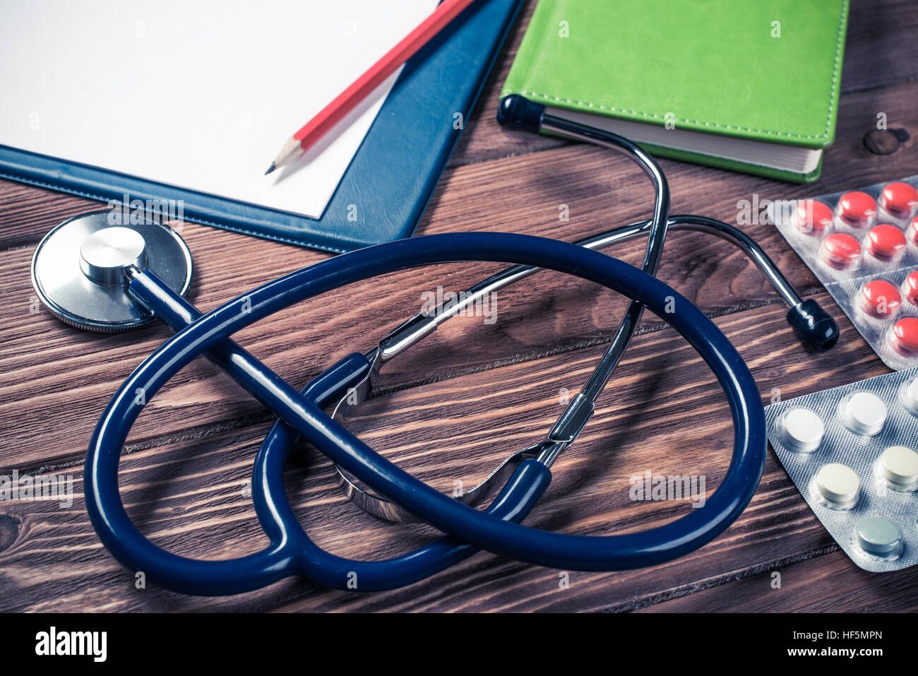 Desk of doctor with medicine things Stock Photo - Alamy