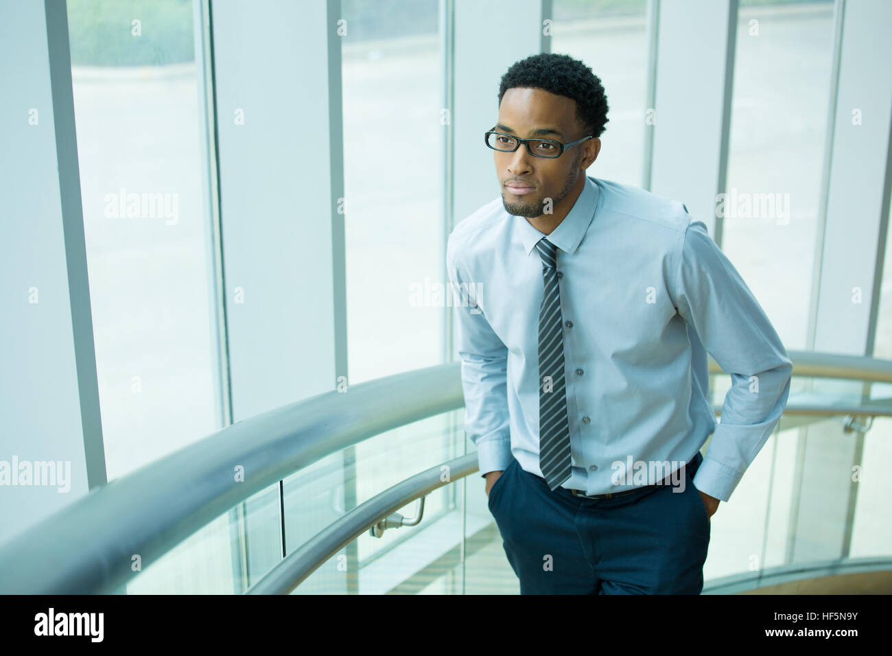 Man in glasses blue shirt hi-res stock photography and images - Alamy