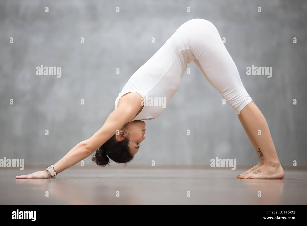 Beautiful Yoga: Downward facing dog pose Stock Photo