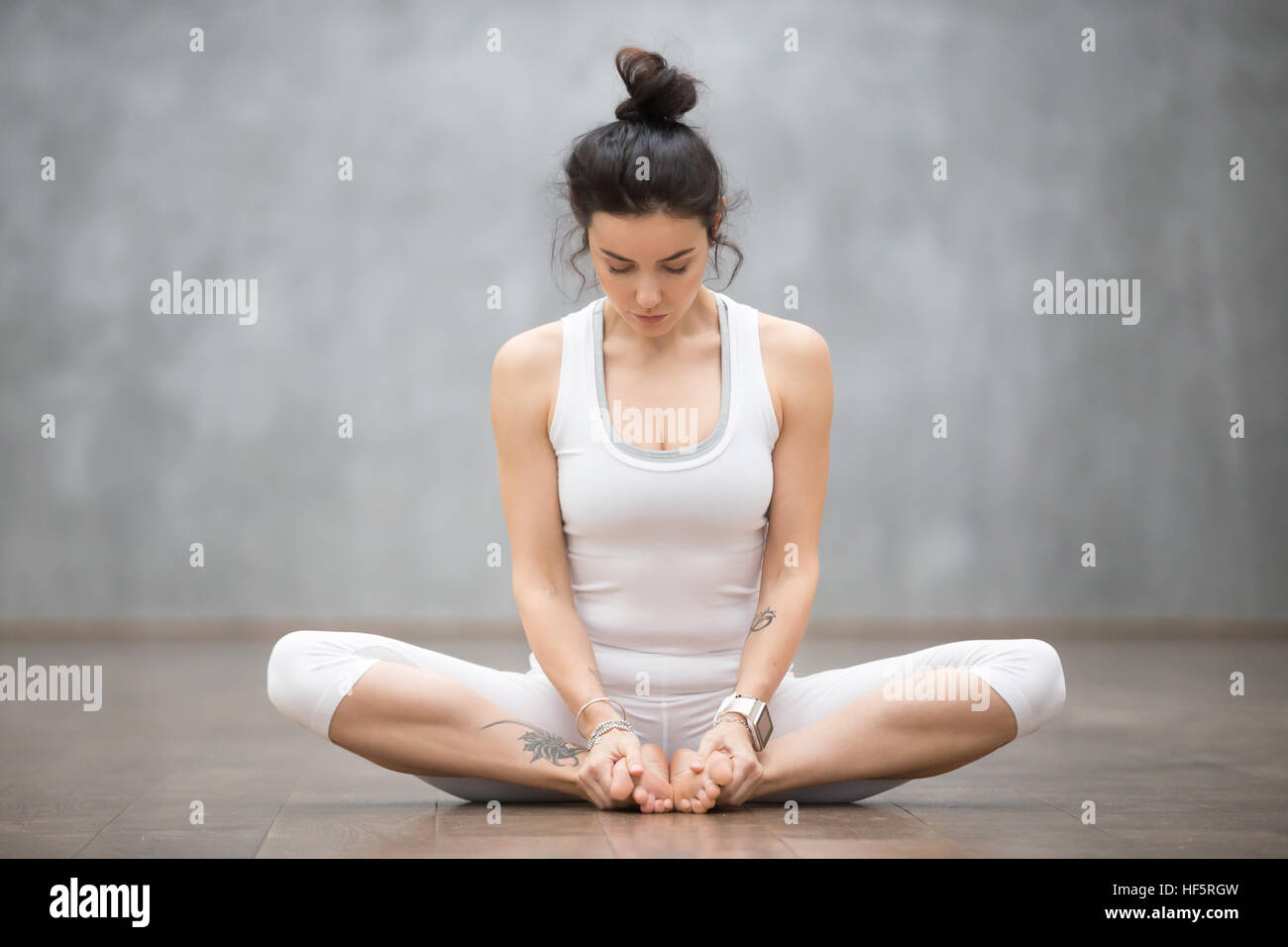 Beautiful Yoga Bound angle pose Stock Photo Alamy