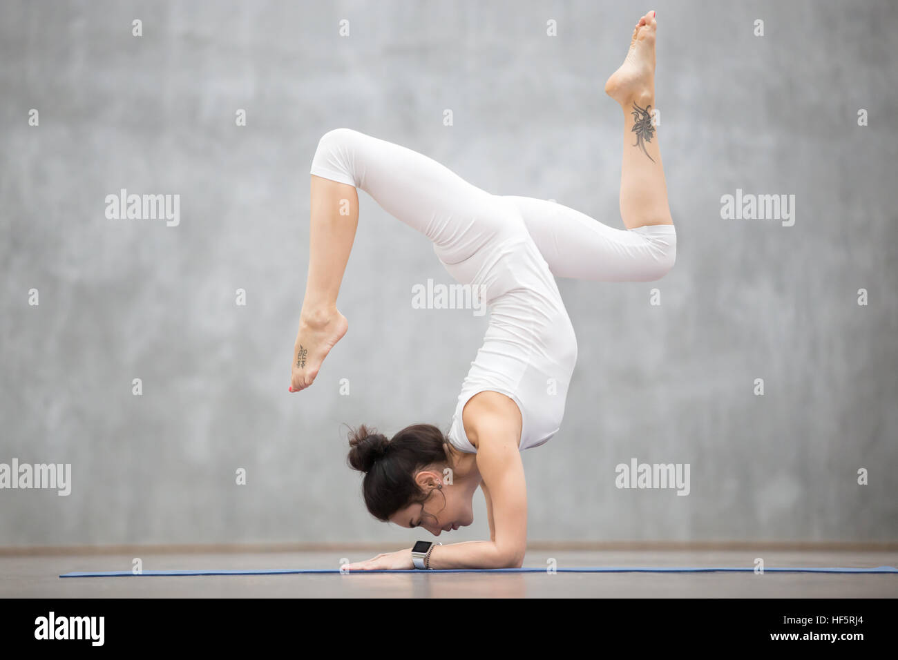 Beautiful Yoga Handstand with bending legs Stock Photo Alamy
