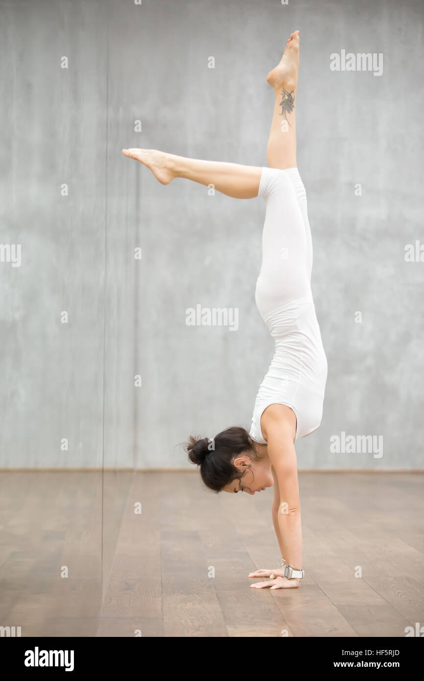 Beautiful Yoga woman doing arm stand Stock Photo Alamy