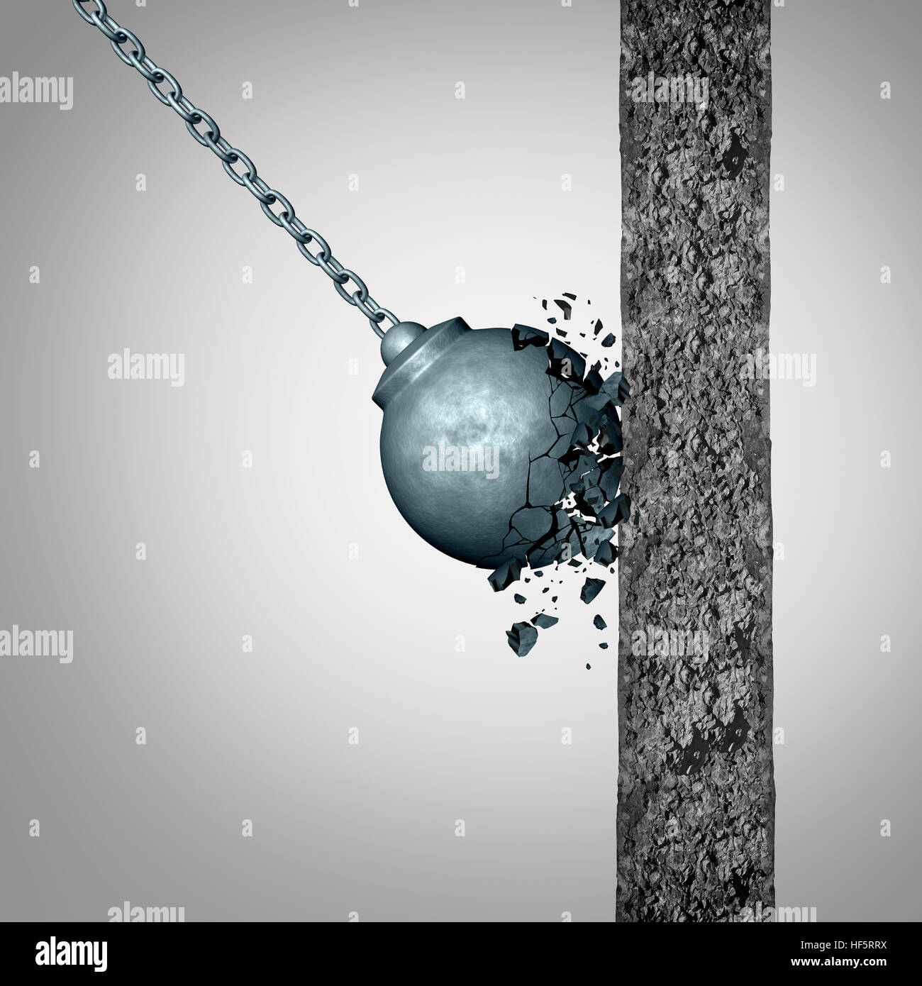 Concept of fragility and strength and resistance as a failing wrecking ball breaking apart after hitting a solid cement wall as a fragile metaphor wit Stock Photo