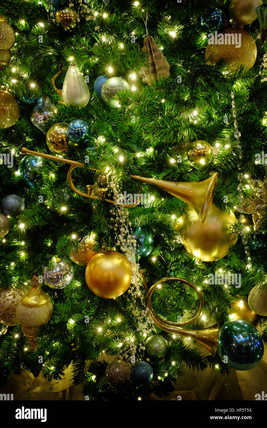 Christmas Tree with Golden Decorations and Trumpet and Horn Stock Image