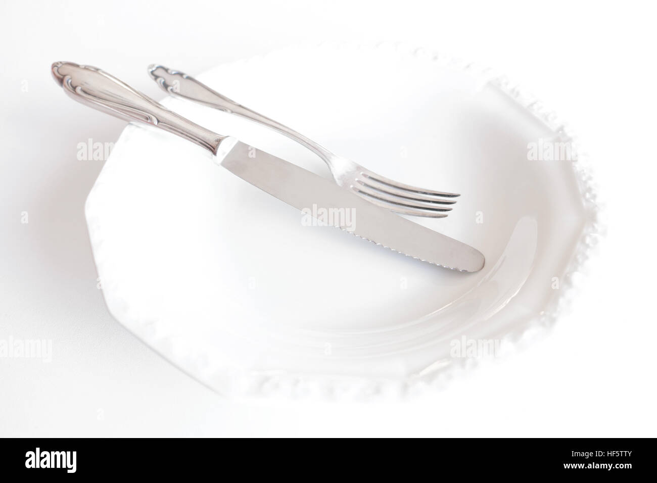 empty plate with knife and fork - beautiful cutlery Stock Photo