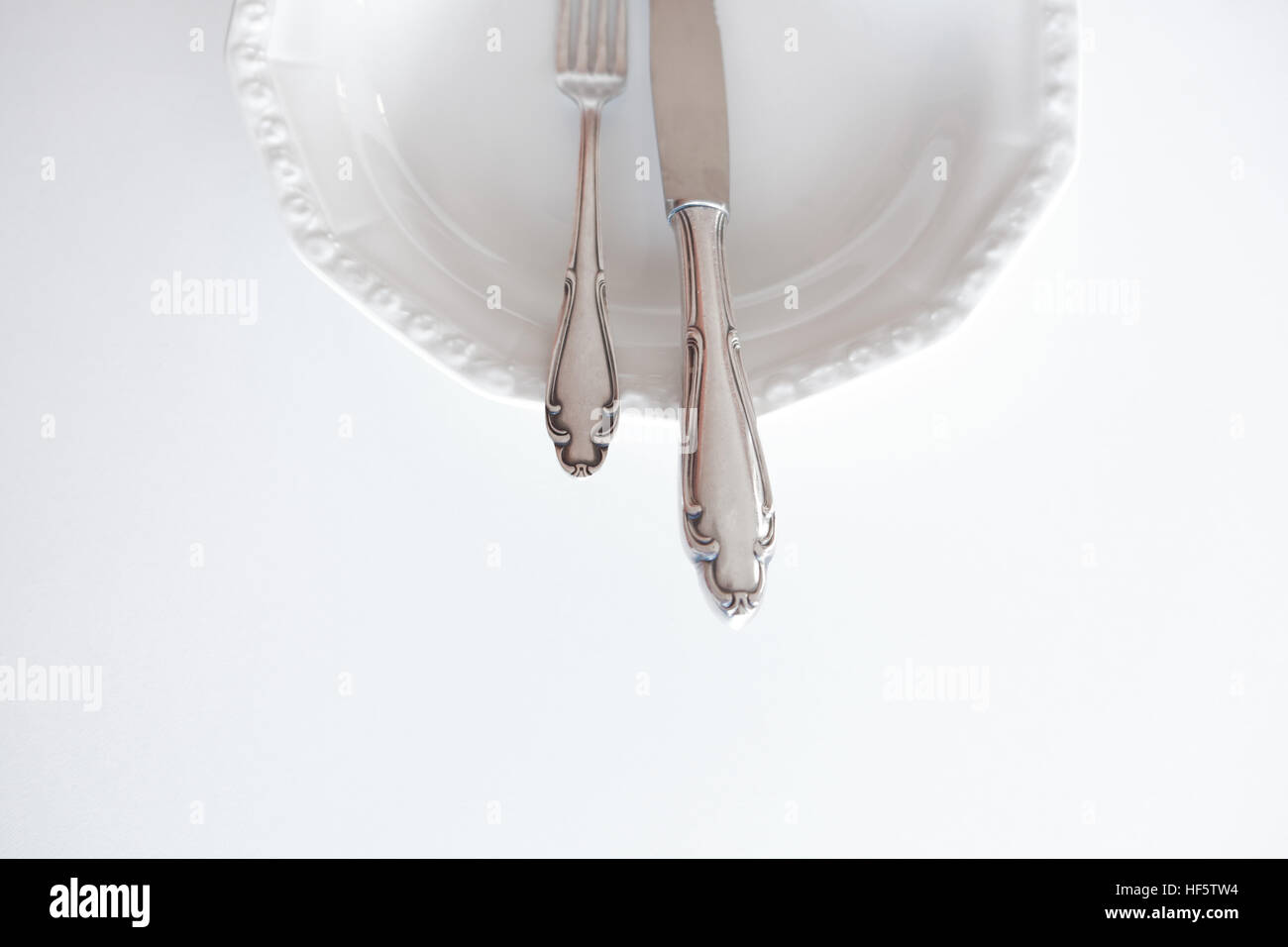 empty plate with knife and fork - beautiful cutlery Stock Photo