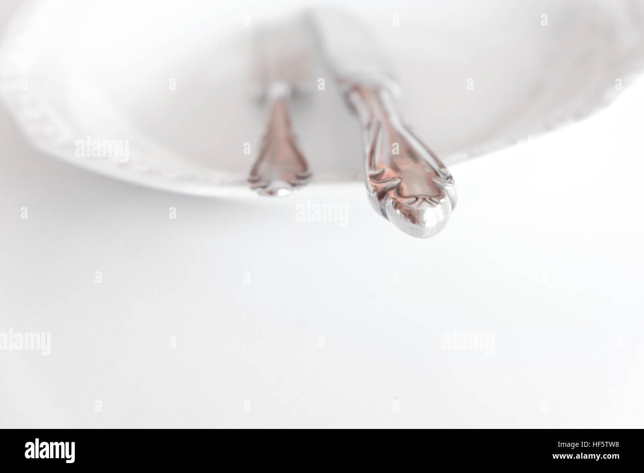 empty plate with knife and fork - beautiful cutlery Stock Photo