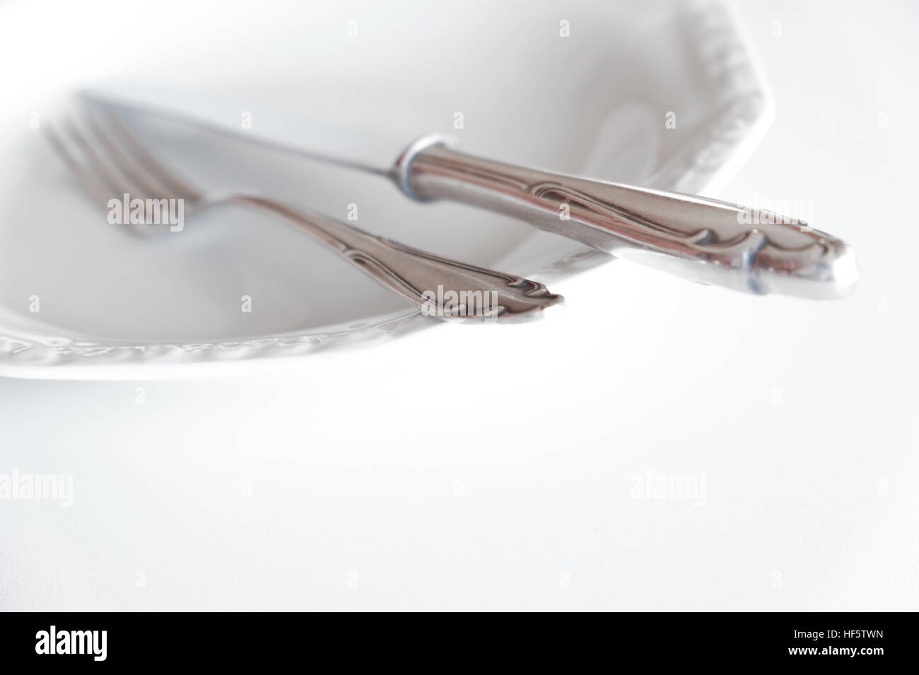 empty plate with knife and fork - beautiful cutlery Stock Photo